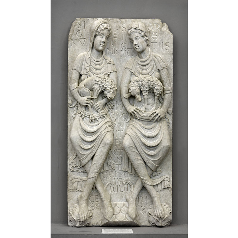 Sculpture en haut-relief représentant deux personnages. L'un tient dans ses bras un lion, l'autre un bélier. L'oeuvre est appelée "Le Signe du Lion et le Signe du Bélier".