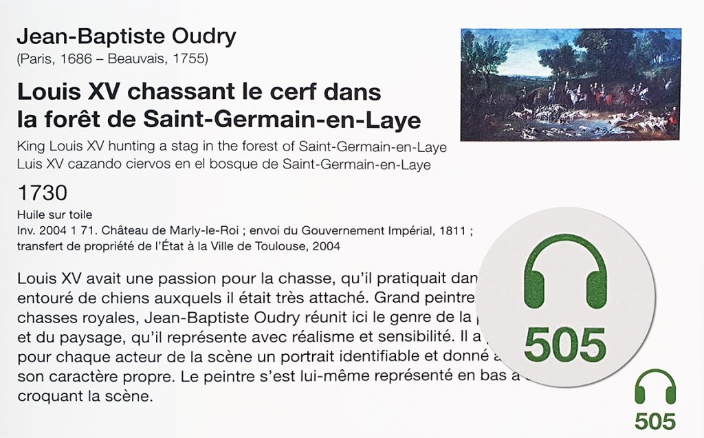 un cartel avec un focus sur le numéro vert de la piste de l'audioguide